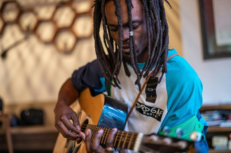 The Science Behind the Harmonics Produced by Guitar Strings
